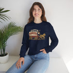 Clovis Pioneers Crewneck Sweatshirt in navy with the Clovis Pioneers logo, a ballplayer with a raised bat riding a horse-drawn covered wagon, with Pioneers on the canvas on the front, worn by model