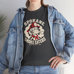 Spokane Smoke Eaters Heavyweight T-Shirt in dark heather with the Spokane Smoke Eaters logo, a Dalmatian in a red fire helmet and bandana blowing smoke on the front, worn by model