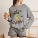 Sanford Celeryfeds Crewneck Sweatshirt in sport grey with the green cartoon celery stalk mascot swinging a bat on the front, worn by model