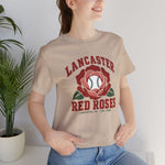 Lancaster Red Roses Premium Lightweight T-Shirt in tan with the Lancaster Red Roses logo, a red rose with a baseball at its center on the front, worn by model