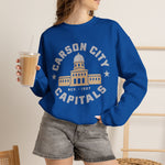 Carson City Capitals Crewneck Sweatshirt in royal with the Carson City Capitals logo, a domed state capitol building inside a ring of block lettering on the front, worn by model