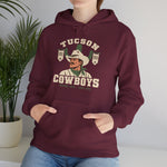 Tucson Cowboys Hoodie in maroon with the Tucson Cowboys logo, a cowboy in front of a saguaro with 1941 and 1953 pennant banners on the front, worn by model