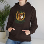 Ocala Yearlings Hoodie in dark chocolate with the horse head peeking through a gold horseshoe wearing a green cap on the front, worn by model