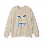 Sarasota Gulls Crewneck Sweatshirt in sand with the cream cartoon gull balancing on a baseball with wings spread on the front