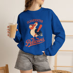 Clearwater Pelicans Crewneck Sweatshirt in royal with the laughing pelican in a red cap swinging a bat with a ball in its beak on the front, worn by model