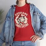 Spokane Smoke Eaters Heavyweight T-Shirt in red with the Spokane Smoke Eaters logo, a Dalmatian in a red fire helmet and bandana blowing smoke on the front, worn by model