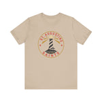 St. Augustine Saints Premium Lightweight T-Shirt in tan with the black and white striped lighthouse emblem with gold rays on the front