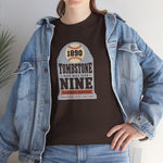 Tombstone Nine Heavyweight T-Shirt in dark chocolate with the Tombstone Nine logo, a grey headstone topped by a baseball marked 1890, with Base Ball Club and a Territorial Champions banner on the front, worn by model