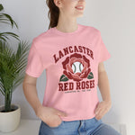 Lancaster Red Roses Premium Lightweight T-Shirt in pink with the Lancaster Red Roses logo, a red rose with a baseball at its center on the front, worn by model