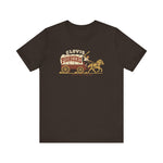 Clovis Pioneers Premium Lightweight T-Shirt in brown with the Clovis Pioneers logo, a ballplayer with a raised bat riding a horse-drawn covered wagon, with Pioneers on the canvas on the front