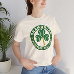 Roseburg Shamrocks Premium Lightweight T-Shirt in natural with the Roseburg Shamrocks logo, a shamrock of baseballs with a bat stem in a green ring on the front, worn by model