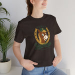 Ocala Yearlings Premium Lightweight T-Shirt in brown with the horse head peeking through a gold horseshoe wearing a green cap on the front, worn by model