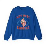 Key West Conchs Crewneck Sweatshirt in royal with the grinning striped conch shell mascot inside a teal diamond outline on the front