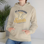 St. Petersburg Saints Hoodie in sand with the cream winged baseball emblem with a halo on the front, worn by model