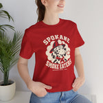 Spokane Smoke Eaters Premium Lightweight T-Shirt in red with the Spokane Smoke Eaters logo, a Dalmatian in a red fire helmet and bandana blowing smoke on the front, worn by model
