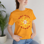 Tri-City Atoms Premium Lightweight T-Shirt in gold with the Tri-City Atoms logo, a baseball at the center of a yellow atom with orbiting electrons on the front, worn by model