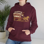 Clovis Pioneers Hoodie in maroon with the Clovis Pioneers logo, a ballplayer with a raised bat riding a horse-drawn covered wagon, with Pioneers on the canvas on the front, worn by model