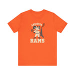 Anniston Rams Premium Lightweight T-Shirt in orange with the Anniston Rams logo, a cartoon ram ballplayer holding a foundry rammer beside a smoking smokestack on the front