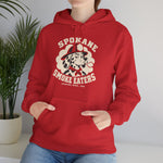 Spokane Smoke Eaters Hoodie in red with the Spokane Smoke Eaters logo, a Dalmatian in a red fire helmet and bandana blowing smoke on the front, worn by model