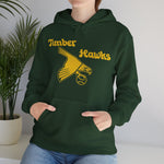 Bend Timber Hawks Hoodie in forest green with the Bend Timber Hawks logo, a diving gold hawk clutching a baseball on the front, worn by model