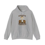 Augusta Tourists Hoodie in sport grey with the cartoon ballplayer with a bat standing on a travel trunk on the front